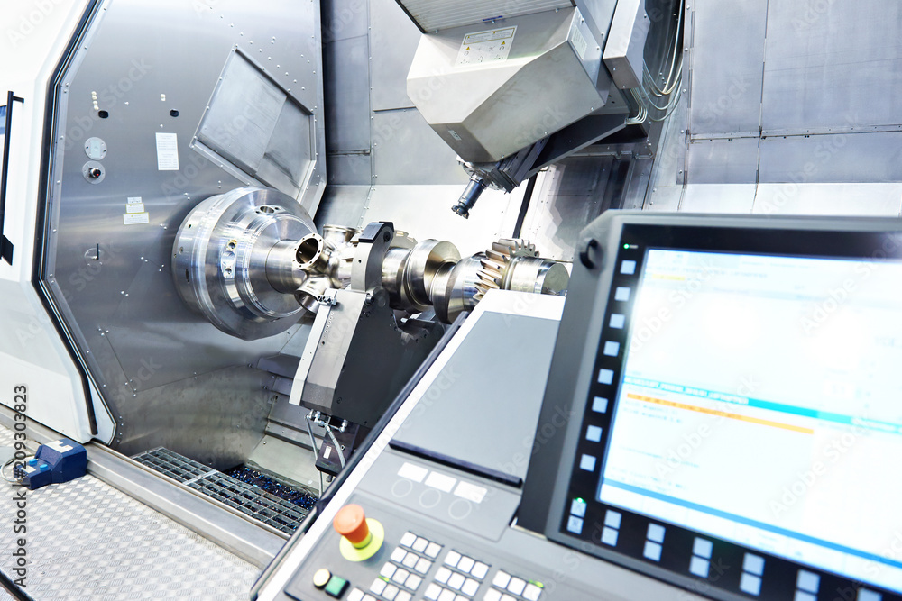 CNC machining centre cutting a steel part